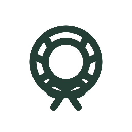 A circular evergreen wreath with leaf details and a ribbon bow sways as a Christmas decoration.