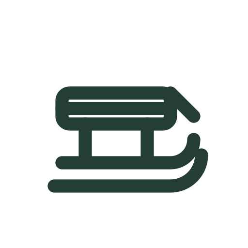A wooden sled with two curved runners slides gently for snow activities and winter sport guides.