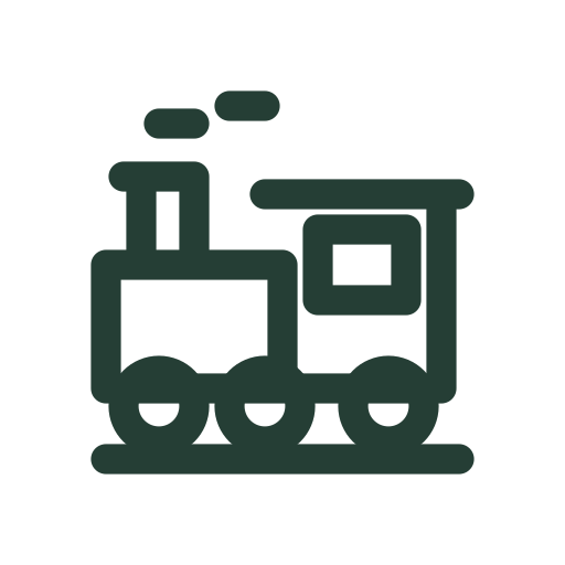 A Christmas toy train with a smokestack, cab and small wheels slides along a short track.